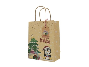 Detail of Christmas kraft paper gift bag with cute penguin and festive holiday tag