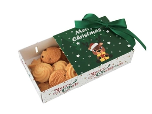 Detail of Christmas drawer gift box featuring deer motif and festive green ribbon