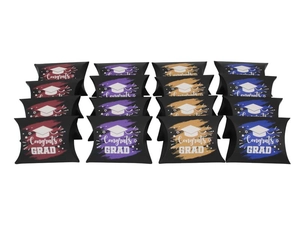 Close-up of pillow-shaped graduation candy boxes with Congrats Grad text and cap design