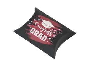 Detail of black pillow-shaped graduation candy box with Congrats Grad print and mortarboard