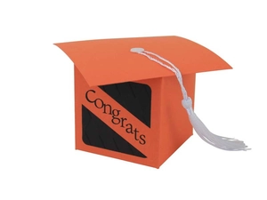 Detail of orange graduation cap gift box with Congrats text and a white tassel