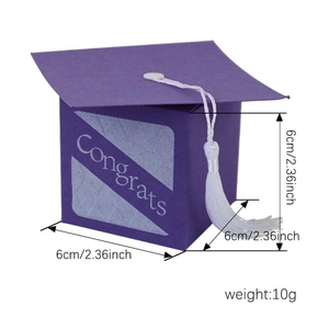 Purple graduation cap candy box with white Congrats text and decorative tassel