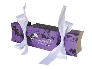 Close-up of purple graduation candy box with ribbons and white congratulatory text