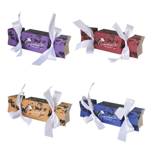 Creative graduation cap candy boxes in four colors with congratulatory text and ribbons