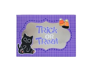 Detail view of Halloween treat box featuring Trick or Treat text and a clear window