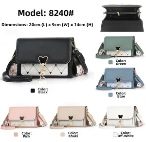 Detailed view of women's crossbody bag dimensions 20x9x14cm with mouse shaped metal lock