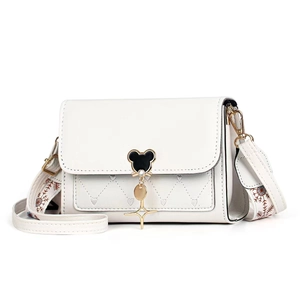 White crossbody bag with Mickey-shaped gold buckle and floral patterned wide strap
