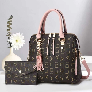 Brown monogram tote bag and clutch set with pink handles and floral background