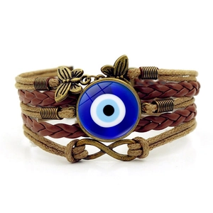 Handmade multilayer leather bracelet with blue evil eye and bronze butterfly accents