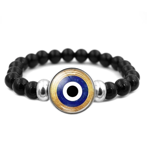 Armband mit blauem Evil Eye Anhänger und polierten schwarzen Perlen für Damen