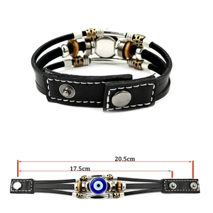 Detail of Turkish evil eye leather bracelet with adjustable metal snap buttons