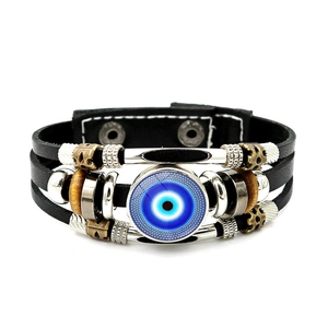 Detailed view of the layered black leather Evil Eye bracelet with antique beads and snap