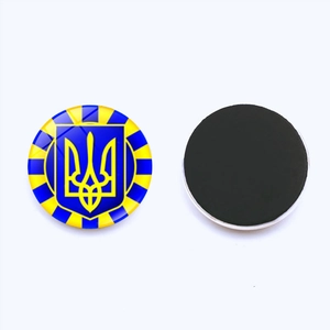 Ukraine emblem glass fridge magnet with blue and yellow sunburst design and magnetic back