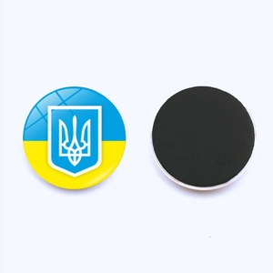 Detail of Ukraine flag fridge magnet with crystal glass dome and black magnetic back