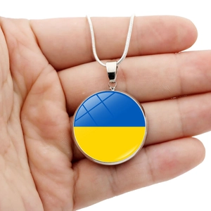 Close-up of a silver round necklace featuring a vibrant blue and yellow Ukraine flag pendant