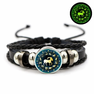 Luminous Aries zodiac leather bracelet with green glow effect in the dark