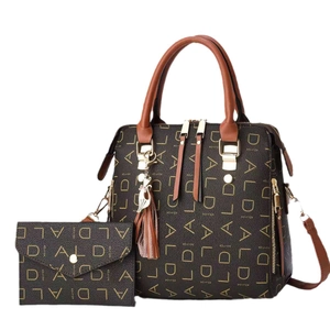 Brown monogram tote bag set with matching pouch and cat pendant on white background