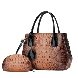 Brown crocodile pattern handbag set with large tote and cosmetic pouch on white background