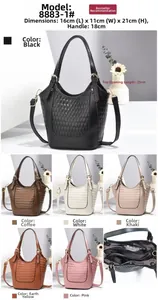 Vue détaillée de la texture matelassée et des compartiments zippés du sac à main