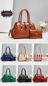 Detail view of crocodile pattern tote and envelope bag dimensions and color options