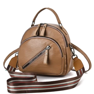 Brown lychee PU leather bag featuring red and green striped webbed shoulder strap detail