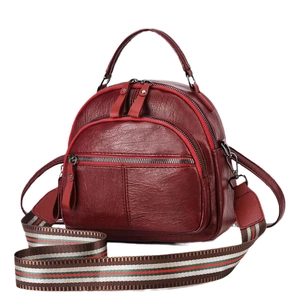 Deep red soft leather mini backpack for women with stylish striped woven shoulder strap