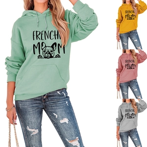 Detail view of Frenchie Mom long sleeve hoodies showing green, yellow, pink and grey colors