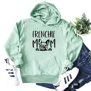 Flat lay of mint green Frenchie Mom hoodie paired with jeans and casual sneakers