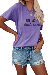 Detail of purple cotton T-shirt with FUN FACT print and distressed blue denim shorts