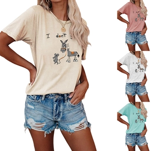 Detail view of cotton t-shirts in almond, pink, white, and mint green with prints