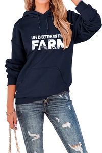 Close-up of Life is Better on the Farm graphic print on a navy blue drawstring hoodie