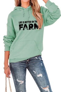 Detail of mint green hoodie with Life Is Better On The Farm text and kangaroo pocket