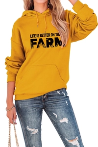 Detail of Mustard Yellow hoodie with Life Is Better On The Farm text and tractor graphic