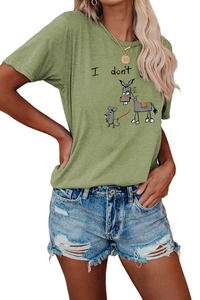 Close-up of avocado green T-shirt with cartoon print and distressed denim shorts