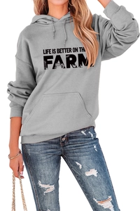 Detail of grey hoodie with Life Is Better On The Farm text and tractor graphic print