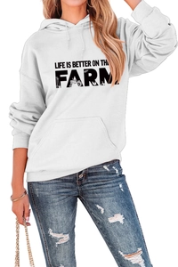Detail of hoodie fabric with Life Is Better On The Farm slogan and tractor graphic