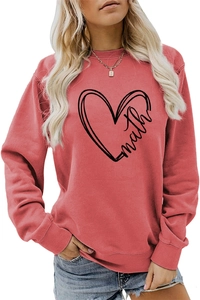 Close-up of coral red sweatshirt featuring math lettering and heart graphic print