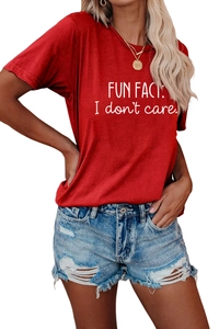 Detail of red crew neck T-shirt with FUN FACT white slogan and denim shorts outfit