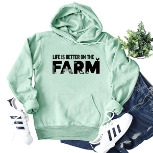 Mint green hoodie featuring Life is better on the farm print with flat lay styling