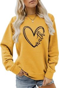Detail shot of math letter heart print on yellow long sleeve sweatshirt fabric