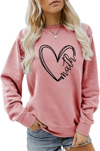 Close-up of pink casual sweatshirt featuring heart pattern and math lettering