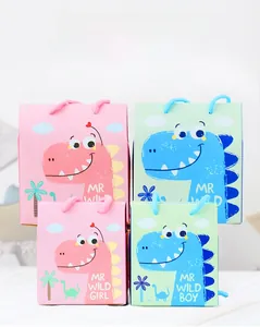 Detail of cute dinosaur baby party candy boxes with woven handles in pink and green