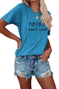 Detailed close-up of blue cotton t-shirt with black FUN FACT: I don't care printed text