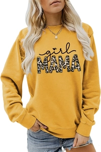 Close-up of mustard yellow sweatshirt featuring leopard print girl MAMA text design