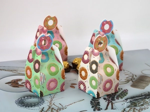 Detail of colorful doughnut pattern gift boxes with creative doughnut shaped handles