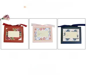 Detailed comparison of red, pink, and blue European floral gift boxes with satin bows