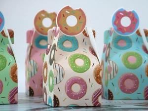 Detail of colorful doughnut pattern gift boxes with creative doughnut-shaped handles