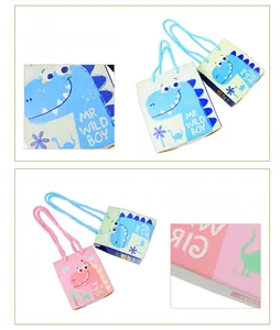 Detail showing the sturdy hand-glued bottom of blue and pink dinosaur gift boxes