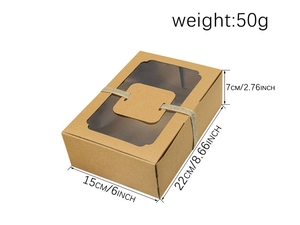 Macro view of kraft paper cake box with clear window and twine decoration including dimensions