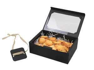 Detail of black kraft paper cake box with large PVC window, raffia, and cookies